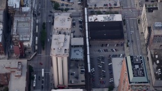 4.8K aerial stock footage of a bird's eye of tracking an L Train through Downtown Chicago, Illinois Aerial Stock Footage | AX0001_144