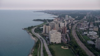 AX0001_158 - 4.8K aerial stock footage following Highway 41 toward apartment buildings in Hyde Park, Chicago, Illinois