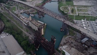 4.8K aerial stock footage approach grain elevator between High Bridge and Chicago Skyway spanning Calumet River, East Side Chicago, Illinois Aerial Stock Footage | AX0001_165