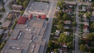 4.8K aerial  video reverse view of Memorial Junior High School, revealing homes in Lansing, Chicago, Illinois Aerial Stock Footage | AX0001_177