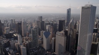 4.8K aerial stock footage flying by Aon Center toward skyscrapers around Chicago River, Downtown Chicago, Illinois Aerial Stock Footage | AX0002_008