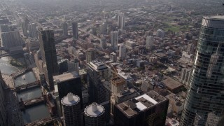 4.8K aerial stock footage flying over the Chicago River and skyscrapers by Trump International Hotel and Tower, Downtown Chicago, Illinois Aerial Stock Footage | AX0002_010