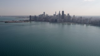 4.8K aerial stock footage tilt from Lake Michigan, revealing Downtown Chicago skyline, Illinois Aerial Stock Footage | AX0002_018