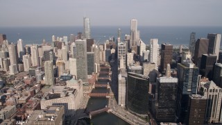 4.8K aerial stock footage tilt from bird's eye of W Fulton Street to reveal the Chicago River and skyscrapers, Downtown Chicago, Illinois Aerial Stock Footage | AX0002_038