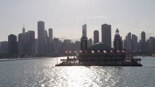 AX0002_049 - 4.8K aerial stock footage tilt from Lake Michigan to reveal and approach Navy Pier and Downtown Chicago, Illinois