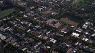 AX0002_059 - 4.8K aerial stock footage bird's eye of neighborhood and school, tilt to reveal row houses in West Side Chicago, Illinois