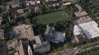 AX0002_062 - 4.8K aerial stock footage of an orbit of St. Ignatius College Prep and football field, West Side Chicago, Illinois