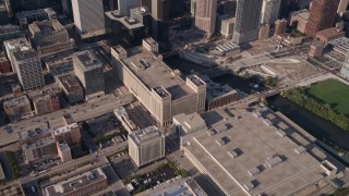 4.8K aerial stock footage tilt up from buildings to reveal Willis Tower and Downtown Chicago cityscape, Illinois Aerial Stock Footage | AX0002_065