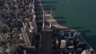 4.8K aerial stock footage approach roof spires on John Hancock Center in Downtown Chicago, Illinois Aerial Stock Footage | AX0002_074