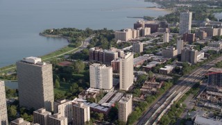 4.8K aerial stock footage of flying by apartment buildings on the shore of Lake Michigan, Hyde Park, Chicago, Illinois Aerial Stock Footage | AX0002_095