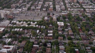 AX0003_014 - 4.8K aerial stock footage of flying over a residential neighborhood in Jackson Park Highlands at twilight, Chicago, Illinois