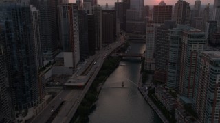 4.8K aerial stock footage of following Chicago River through Downtown Chicago, Illinois, sunset Aerial Stock Footage | AX0003_036