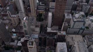 4.8K aerial stock footage tilt from bird's eye of N Michigan Avenue to reveal John Hancock Center at sunset, Illinois Aerial Stock Footage | AX0003_051