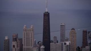 4.8K aerial stock footage of flying by John Hancock Center, Downtown Chicago, Illinois, twilight Aerial Stock Footage | AX0003_091