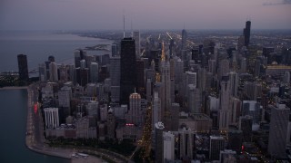 4.8K aerial stock footage approach John Hancock Center and waterfront high-rises at twilight, Downtown Chicago, Illinois Aerial Stock Footage | AX0003_095