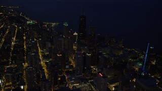 4.8K aerial stock footage of flying over Downtown Chicago toward John Hancock Center, at night, Illinois Aerial Stock Footage | AX0003_157