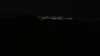 5K aerial stock footage orbit radio tower atop the Hollywood Hills at night, California Aerial Stock Footage | AX0004_012E