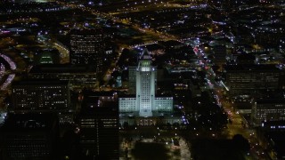 5K aerial stock footage orbit of Los Angeles City Hall at night in Downtown Los Angeles, California Aerial Stock Footage | AX0004_051