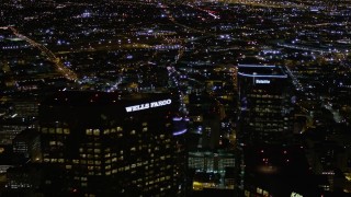 5K aerial stock footage top of Wells Fargo Center at night in Downtown Los Angeles, California Aerial Stock Footage | AX0004_057