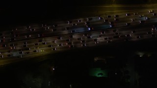 5K aerial stock footage bird's eye view of heavy freeway traffic at night in Hollywood, California Aerial Stock Footage | AX0004_069E