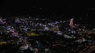 AX0004_072E - 5K aerial stock footage orbit buildings between Sunset and Hollywood Boulevard at night, California