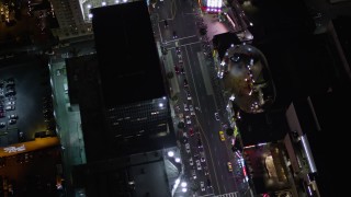 AX0004_078 - 5K aerial stock footage bird's eye orbit of Grauman's Chinese Theater at night on Hollywood Boulevard, California