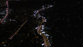 5K aerial stock footage approaching Sunset Strip at night in West Hollywood, California Aerial Stock Footage | AX0004_080E