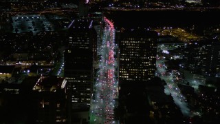 5K aerial stock footage fly over nighttime traffic on Wilshire Boulevard in Westwood, California Aerial Stock Footage | AX0004_089E