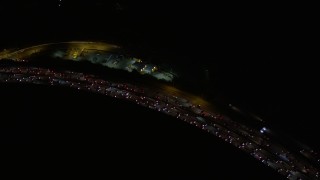 5K aerial stock footage of bird's eye view of panning across Interstate 405 at night, California Aerial Stock Footage | AX0004_103