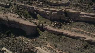 5K aerial stock footage fly over layers of rocks at Vasquez Rocks Park in the Mojave Desert, California Aerial Stock Footage | AX0005_041E