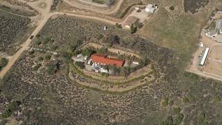 5K aerial stock footage of a rural desert home in the Mojave Desert, California Aerial Stock Footage | AX0005_050