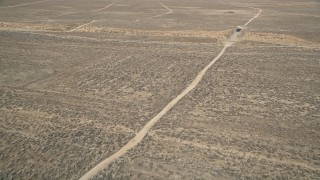 AX0005_066 - 5K aerial stock footage orbit dirt road in the desert in Antelope Valley, California