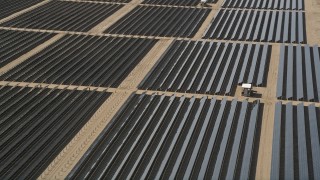 5K aerial stock footage of an orbit of solar array panels in the desert of Antelope Valley, California Aerial Stock Footage | AX0005_079