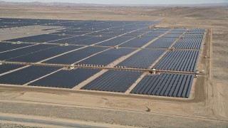 5K aerial stock footage orbit a large solar energy array in the Mojave Desert, California Aerial Stock Footage | AX0005_090E