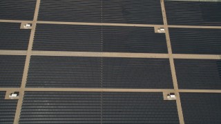 AX0005_106E - 5K aerial stock footage of bird's eye of Mojave Desert solar energy array in California