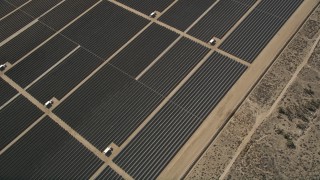 AX0005_108 - 5K aerial stock footage of bird's eye orbit of Mojave Desert solar energy array in California 