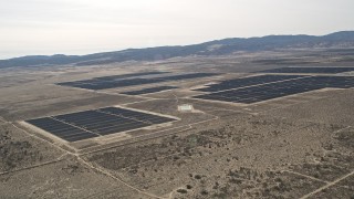 5K aerial stock footage of a large solar energy array in the Mojave Desert, California Aerial Stock Footage | AX0005_115