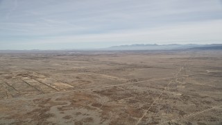 5K aerial stock footage of flying over open desert in Antelope Valley, California Aerial Stock Footage | AX0005_116