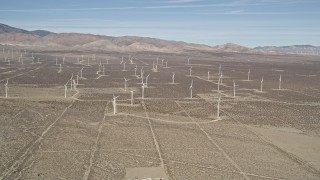 5K aerial stock footage approach a field of windmills in the Mojave Desert, California Aerial Stock Footage | AX0005_124