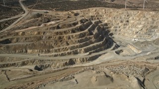 5K aerial stock footage orbit a desert quarry pit in Antelope Valley, California Aerial Stock Footage | AX0006_034E