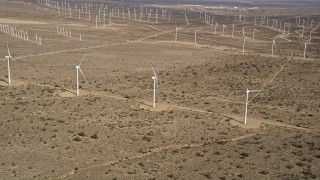 5K aerial stock footage approach three windmills at a wind farm in the California desert Aerial Stock Footage | AX0006_044