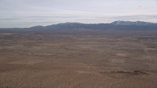 5K aerial stock footage of VFX Plate of desert with mountains background, Mojave Desert, California Aerial Stock Footage | AX0006_119