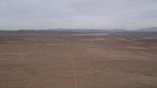 5K aerial stock footage tilt up and fly over open desert in California Aerial Stock Footage | AX0006_120