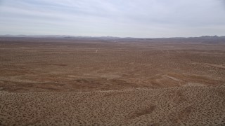 5K aerial stock footage pan for a wide view of the open desert, Mojave Desert, California Aerial Stock Footage | AX0006_147E