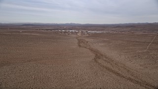 5K aerial stock footage video of approaching a small desert town, Helendale, California Aerial Stock Footage | AX0006_157E