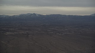 5K aerial stock footage of Background VFX Plate of Mojave Desert and mountains with snow at Sunset, California Aerial Stock Footage | AX0007_020