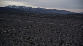 5K aerial stock footage fly over desert roads in Mojave Desert at twilight, California Aerial Stock Footage | AX0007_042