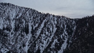 5K aerial stock footage approach ridge with winter snow in the San Gabriel Mountains at twilight, California Aerial Stock Footage | AX0008_010