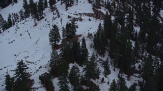 AX0008_023 - 5K aerial stock footage of slopes with winter snow at Mount Baldy Ski Lifts in California, twilight