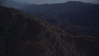 5K aerial stock footage orbit power lines on a slope at twilight in the San Gabriel Mountains, California Aerial Stock Footage | AX0008_046